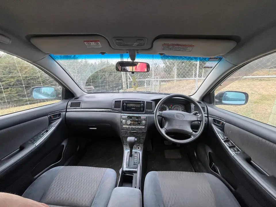 Full dashboard and windscreen seen from the rear seat