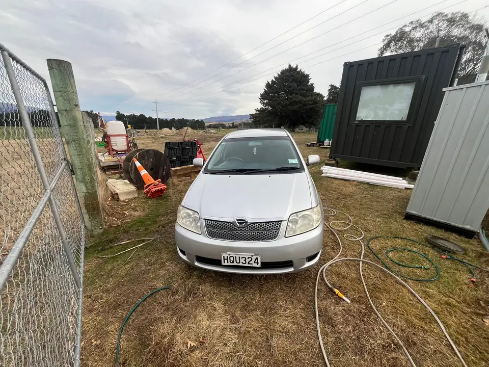 Front of the wagon seen through the paddock gate