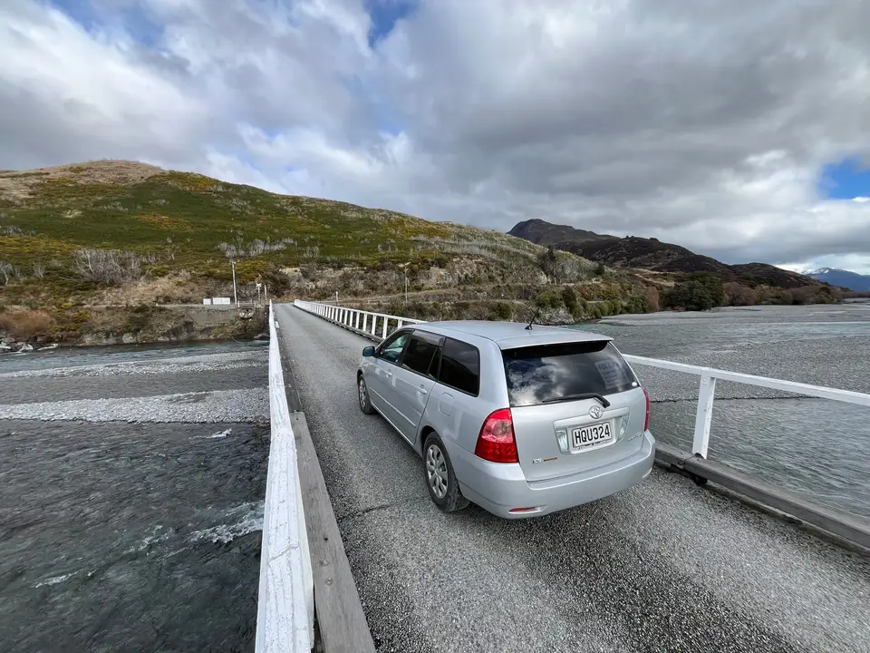 On a one-lane bridge above the water
