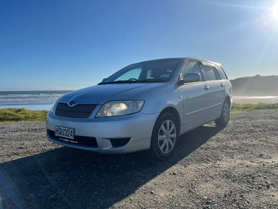 Parked above a beach with the sea behind