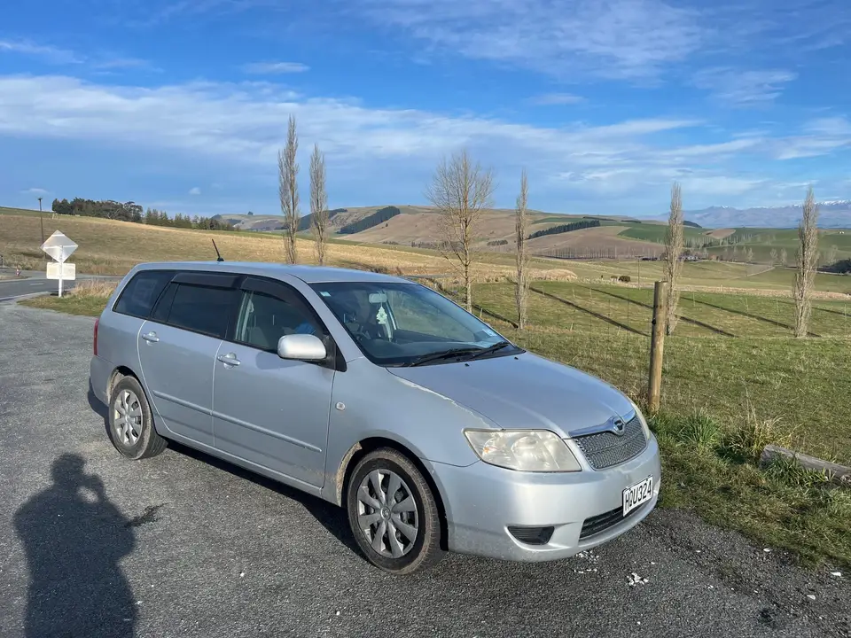 Parked on a rural roadside among poplars and farmland