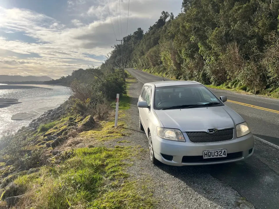 Parked on a coast road above a braided river mouth